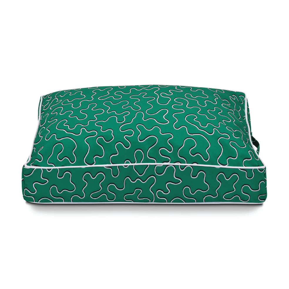 patterned dog bed with green black white